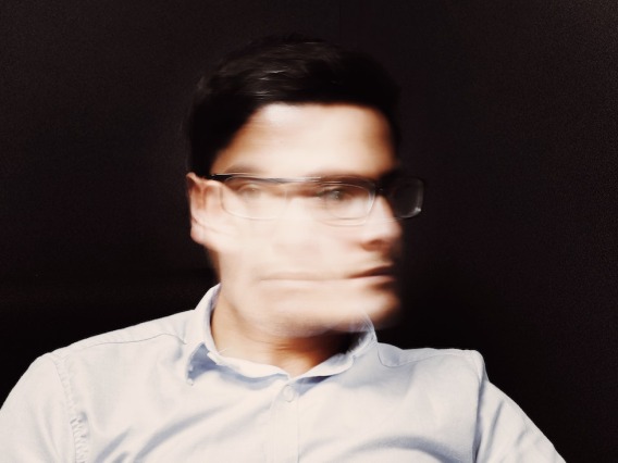 Man with blurry face due to motion