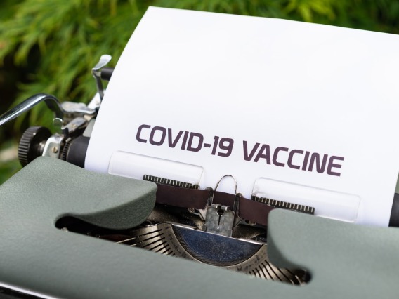 Typewriter with "COVID-19 Vaccine" on white paper - Unsplash, Marcus Winkler