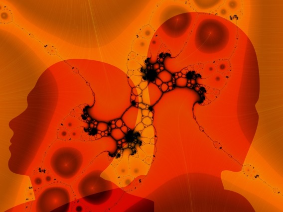 Orange human head silhouettes with fractal patterns representing neurons
