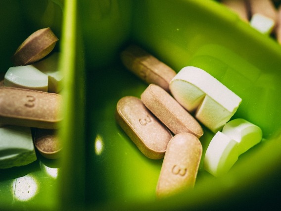 Medication in a green container