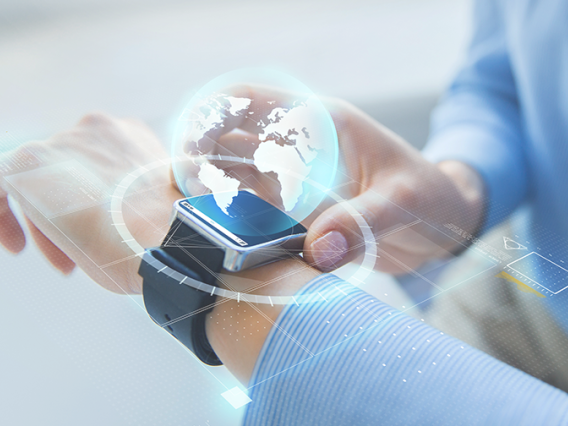 person touching a smart watch with a globe image