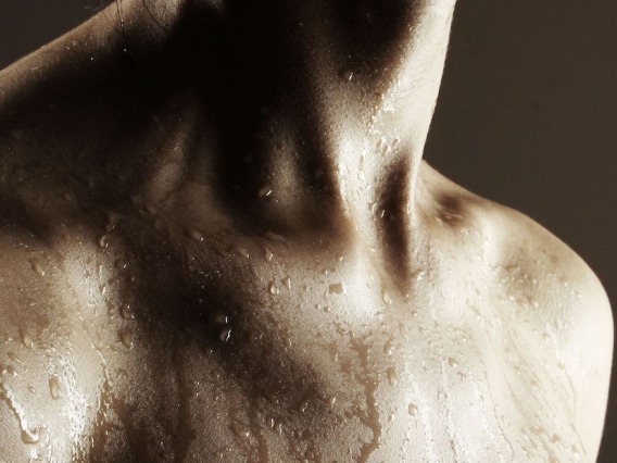Upper body of a person with sweat.