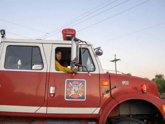 Firefighters in a firetruck.