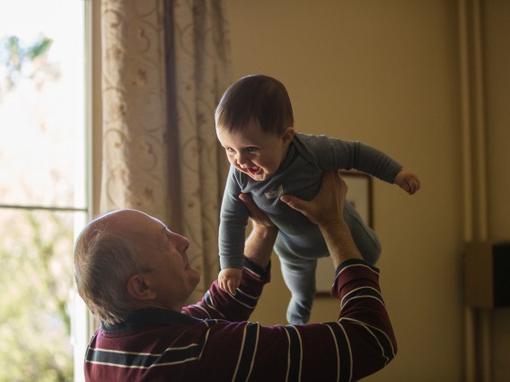 Older Man Holding a Baby