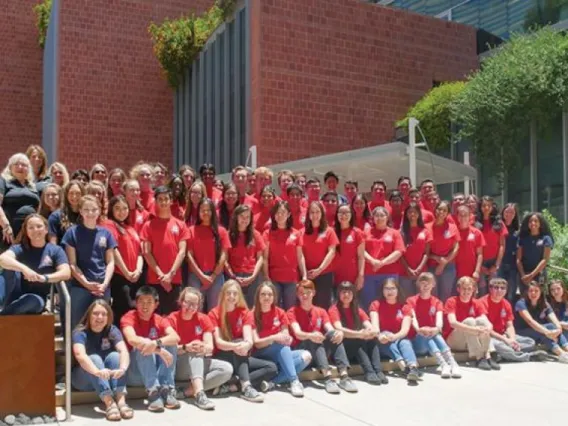 Group of KEYS interns pose in red shirts in front of the BIO5 Institute