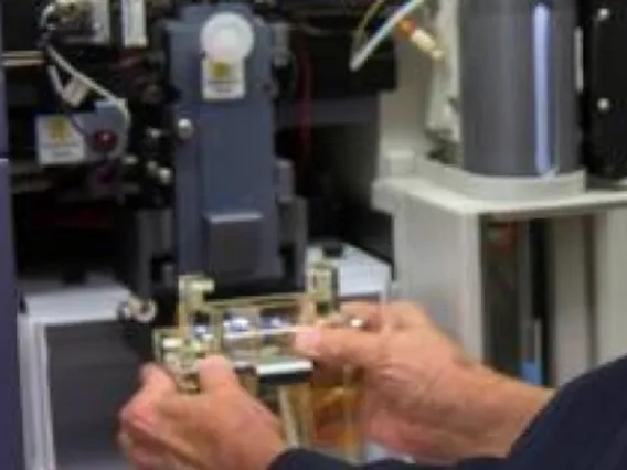 a researcher using equipment in a lab