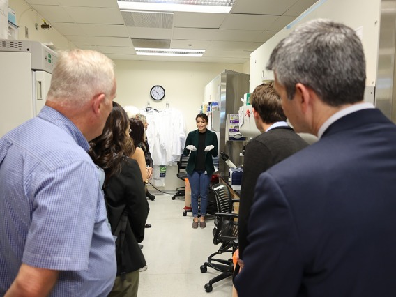 A group of people getting a tour of a research lab