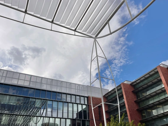 Shot of building with blue sky and clouds