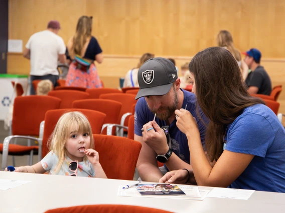 A family with two parents and one daughter trying the Supertasters experiment