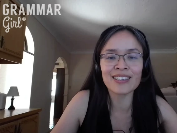 Person smiling during a 'Grammar Girl' video call session, seated in a living room.