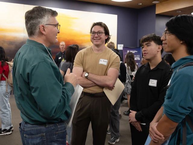 Group of people networking at a indoor event
