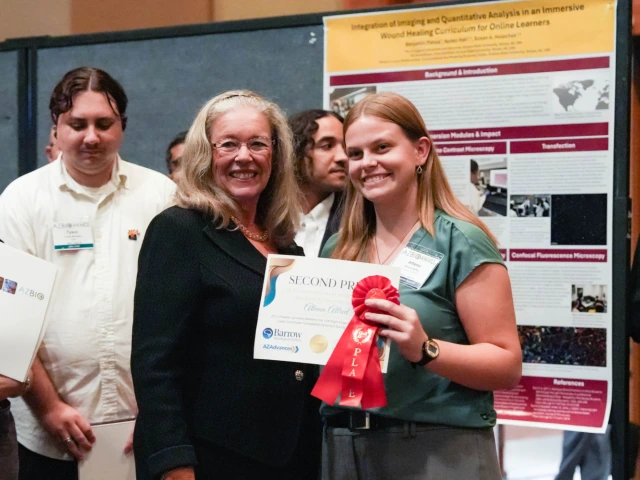 Joan Koerber-Walker, President and CEO of the Arizona Bioindustry Association, and Athena Allred, KEYS Alumna, as Allred won second place at the Student Discovery Zone.