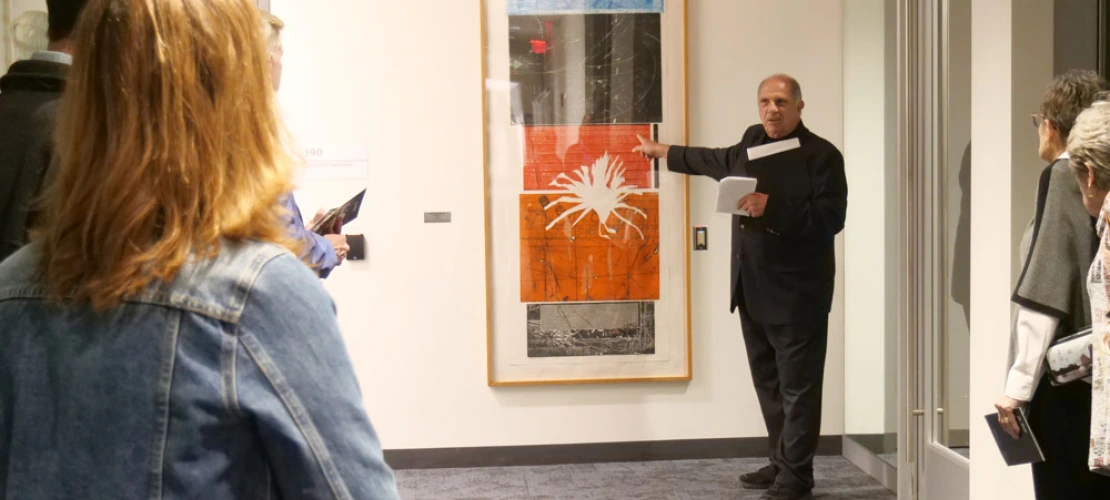 Man describes artwork at the BIO5 Institute