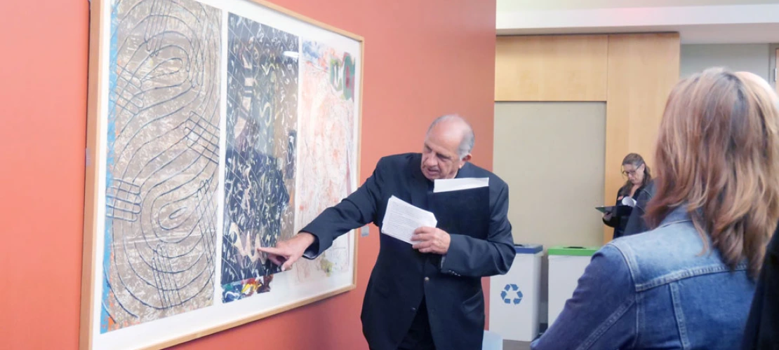 Man describes artwork at the BIO5 Institute