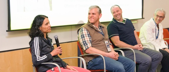 A group of scientist sitting for a panel event