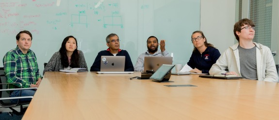 A group of people meeting in a conference