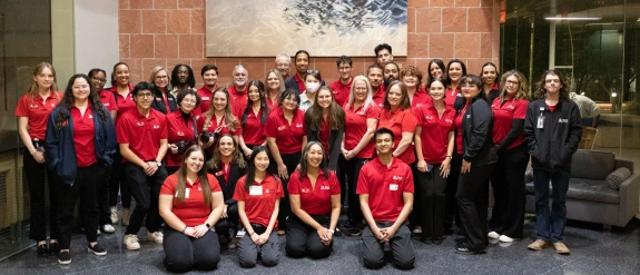 Large group of people wearing red shirts