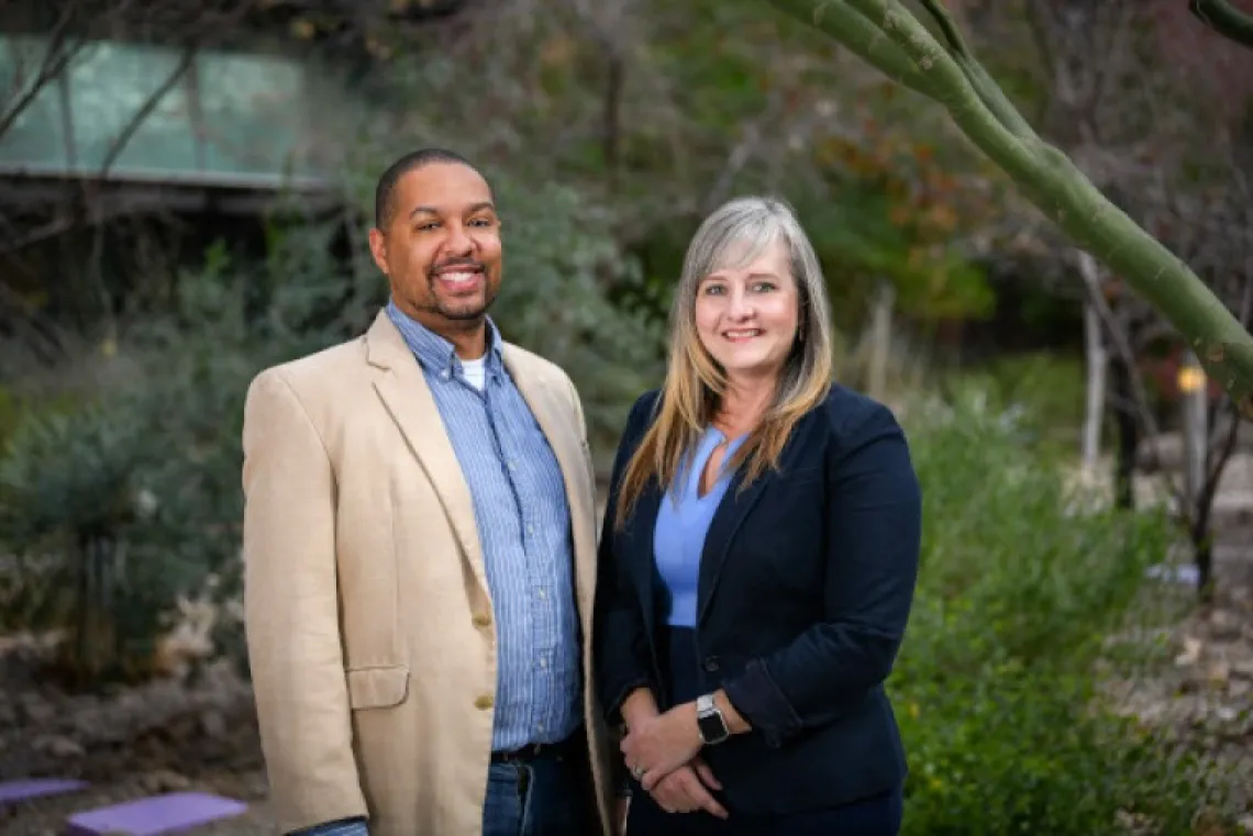 Michael Johnson and Julie Ledford pose side by side in the breezeway of the BIO5 Institute