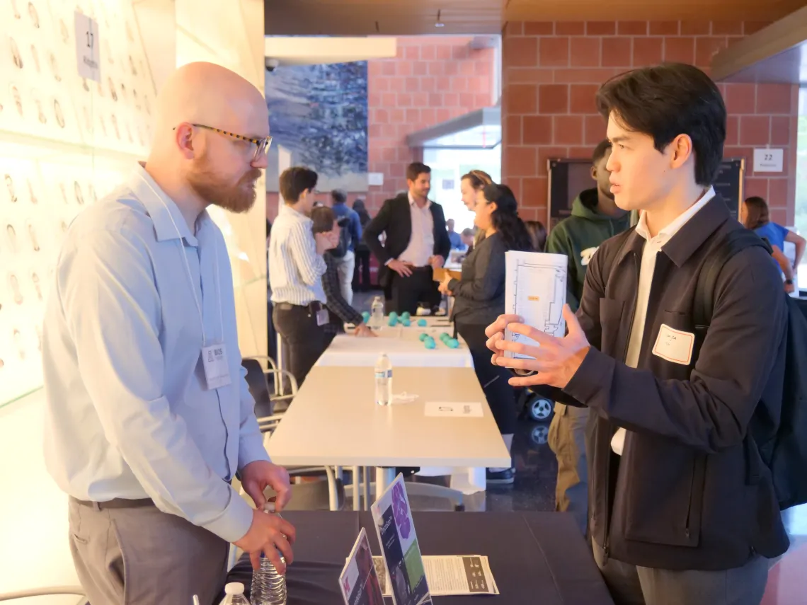 Arizona bioindustry representative speaks with a University of Arizona student at the BIO5 Student Industry Networking Event