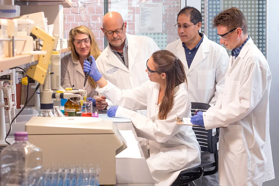 a group of researcher working in a lab