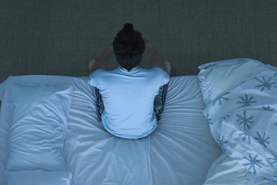 Man sitting on the bed