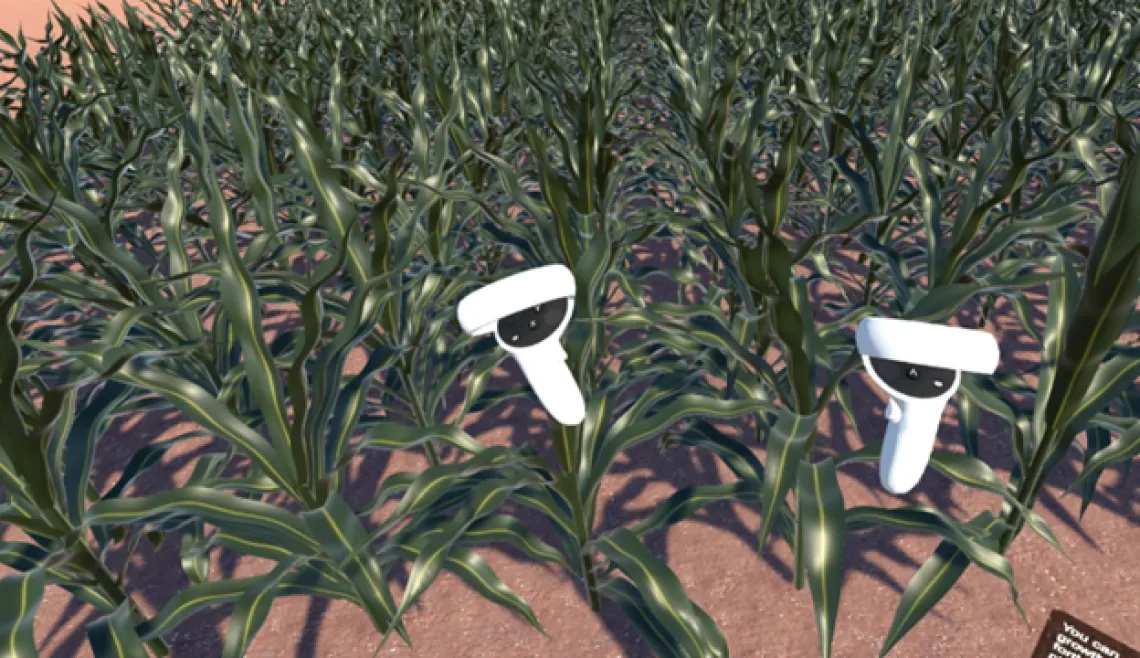 Two animated characters resembling megaphones with eyes are standing among rows of cornstalks in a field.