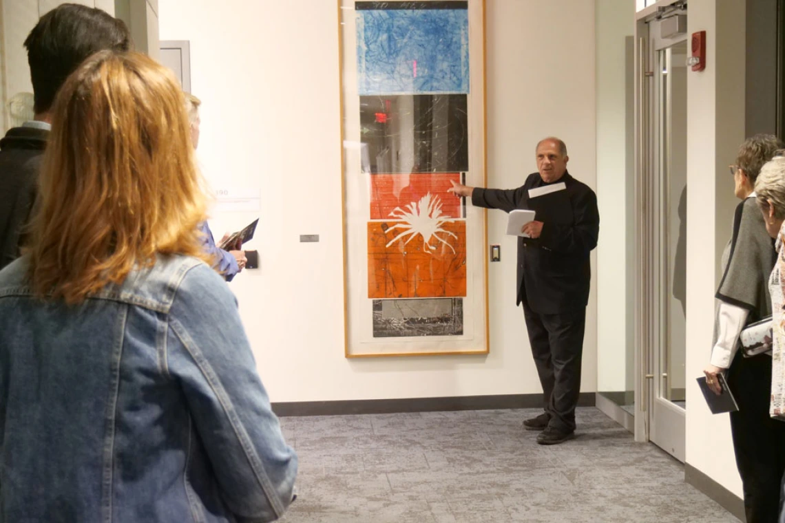 Man describes artwork at the BIO5 Institute