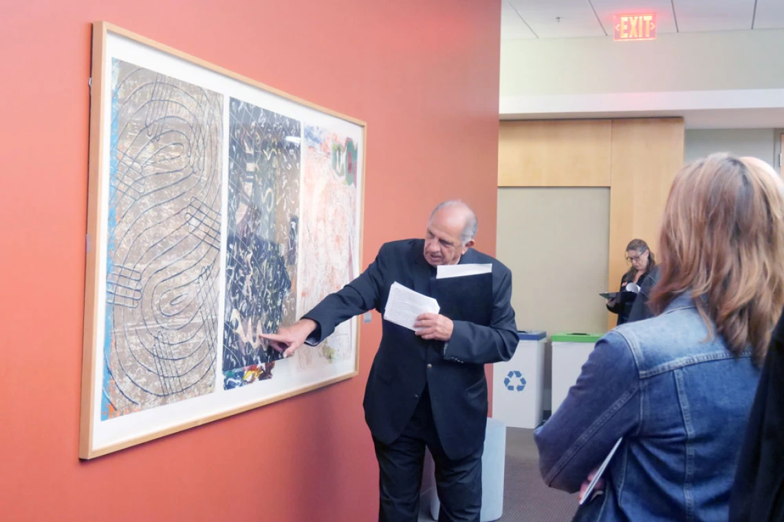 Man describes artwork at the BIO5 Institute