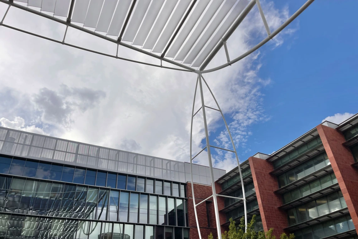 Shot of building with blue sky and clouds