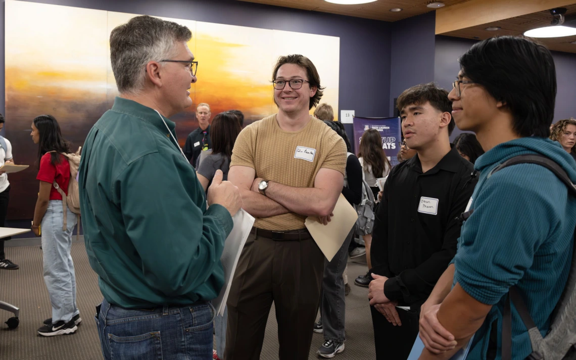Group of people networking at a indoor event