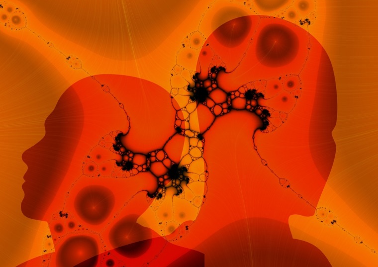 Orange human head silhouettes with fractal patterns representing neurons