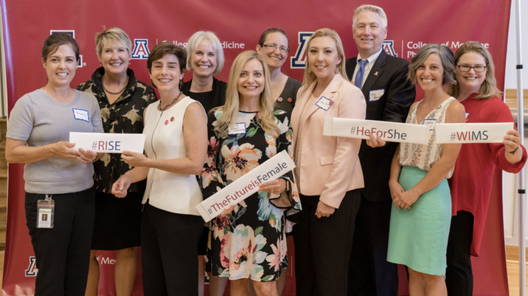 Members of Women in Medicine and Science with College of Medicine – Phoenix Dean Guy Reed, MD, smiling at the 2019 annual dinner.