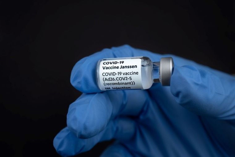 Close-up shot of a doctor holding a COVID-19 Vaccination vile