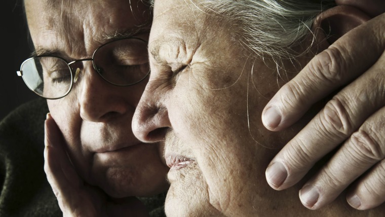 An older Couple Holding Each other