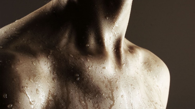 Upper body of a person with sweat.