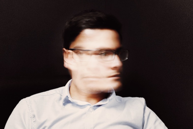 Man with blurry face due to motion