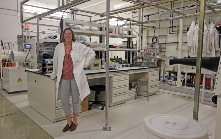 Dr. Ratcliff standing in a lab.