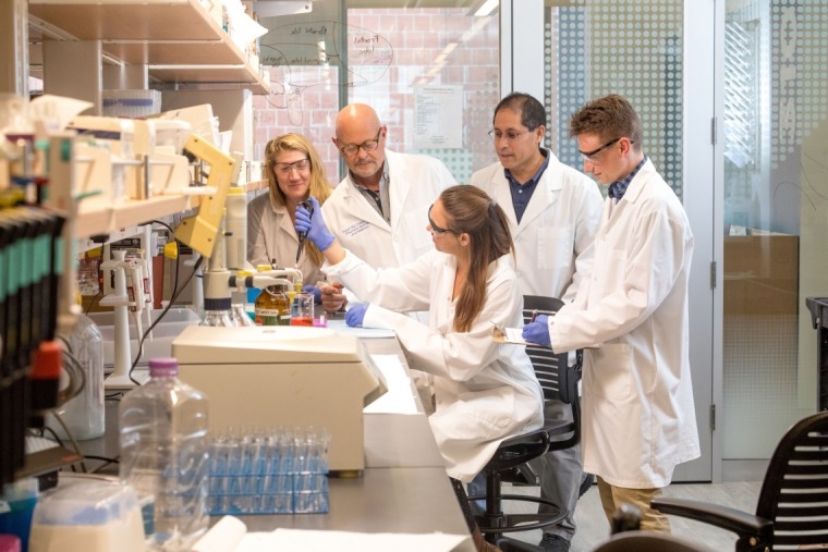 Floyd "Ski" Chilton (second from left) and his lab team examine how genetic and epigenetic variations interact with human diets to drive inflammation and inflammatory disorders, as well as psychiatric and developmental disorders.