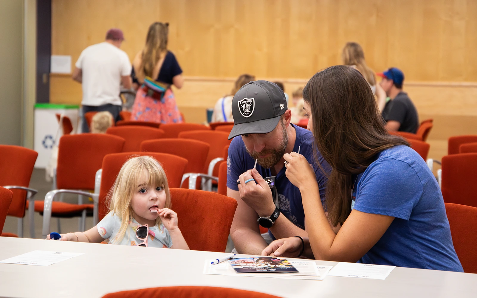 A family with two parents and one daughter trying the Supertasters experiment