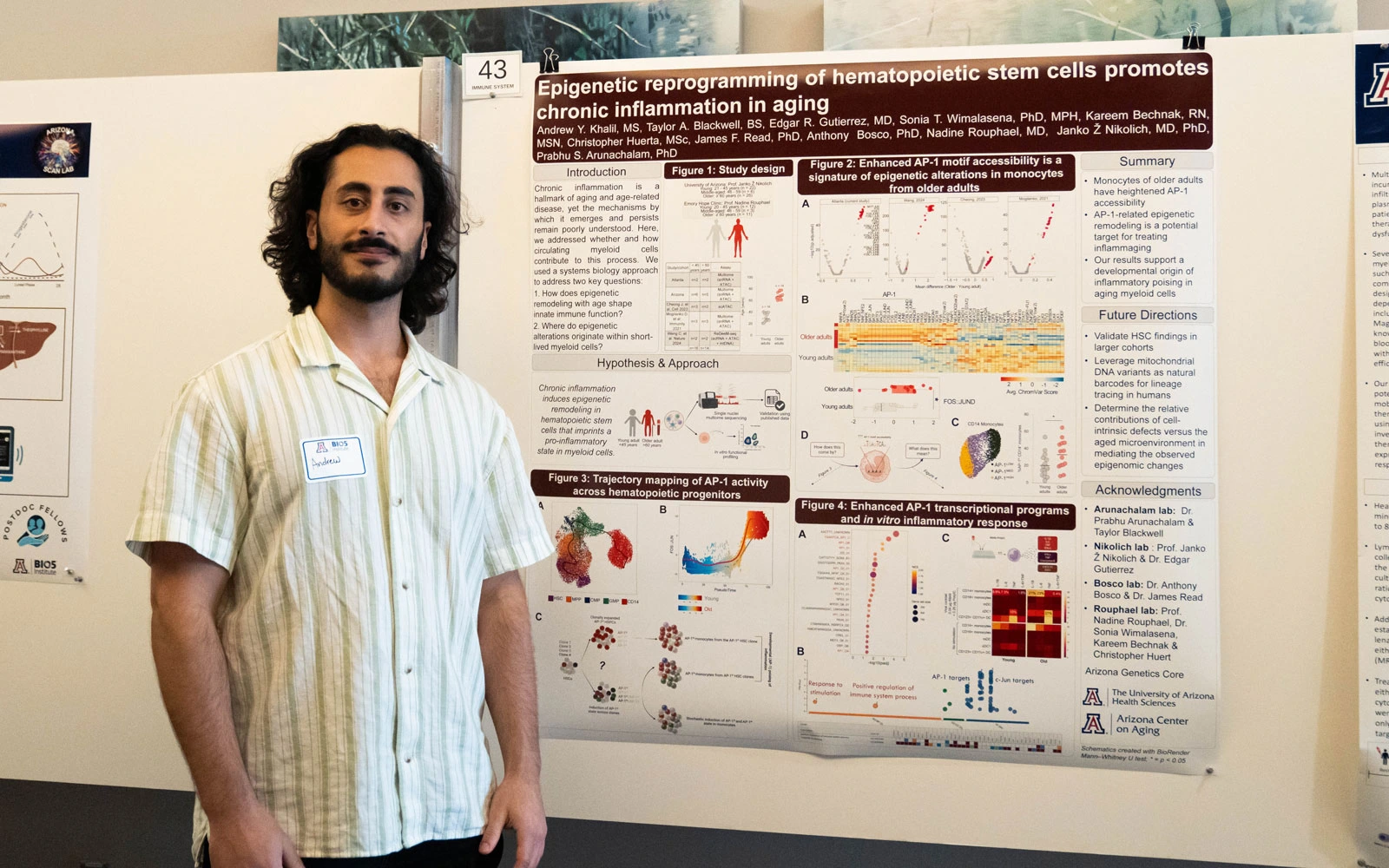 Person standing in front of a scientific poster presentation on epigenetic reprogramming in hematopoietic stem cells, at a conference.