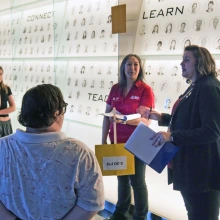 Group of people listen as a tour guide describes the BIO5 Institute