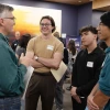 Three people talking at a networking event at the BIO5 Institute