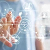 Image of a person touching a futuristic digital interface with icons related to healthcare such as a heart, a pill, a dropper, and medical charts.