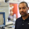 A man standing in a lab setting. 