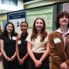 Morgan Mollberg, Abrielle Anchondo-Leyva, Kadence Modica, Caroline Lasch, and Julian Amaya pose in front of their research posters at the Student Discovery Zone.