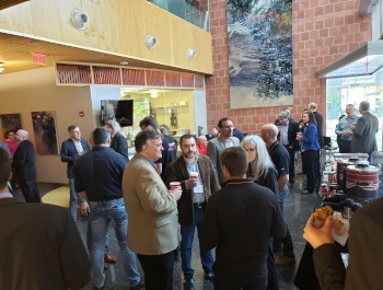 People networking in Keating lobby during AZ Photonics Days