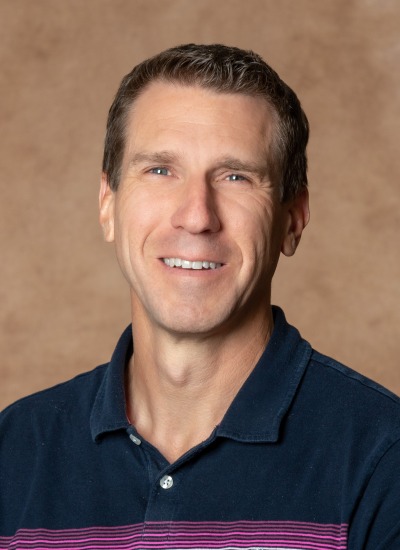 Headshot of Dr. Travis Wheeler